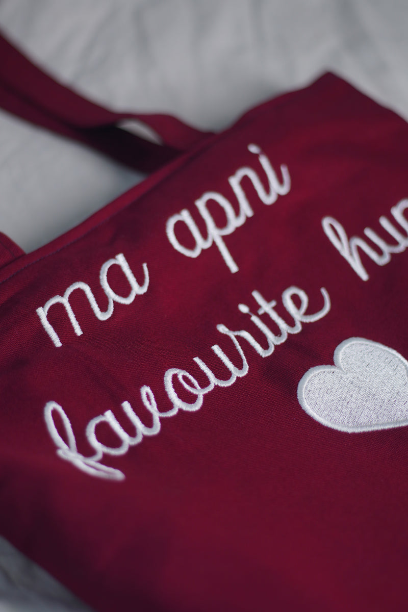 Ma Apni Favourite hun! Maroon jeans Embroidered tote bag