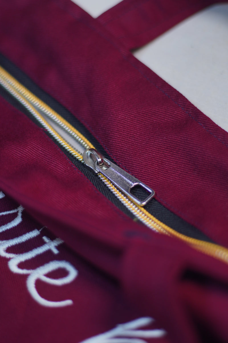 Ma Apni Favourite hun! Maroon jeans Embroidered tote bag