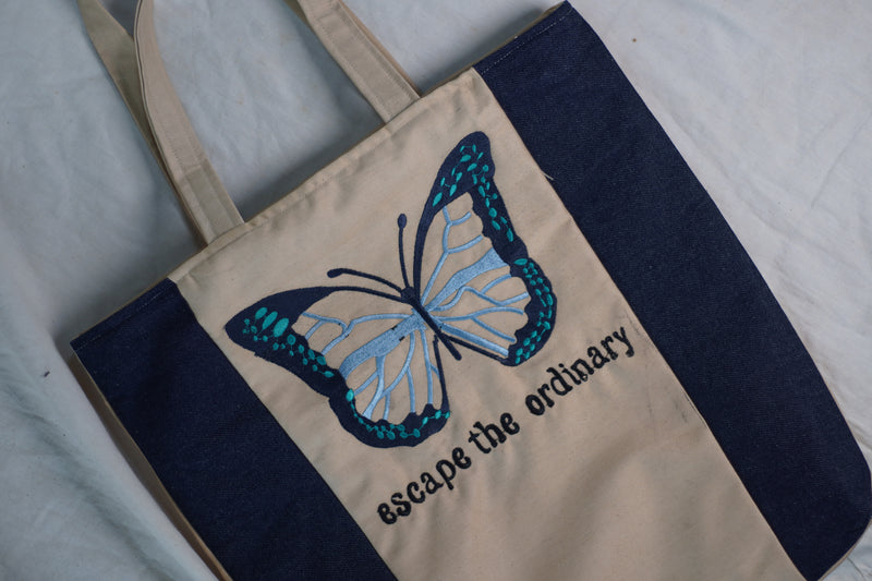 Escape the Ordinary , Butterfly Embroidered beige color jeans tote bag