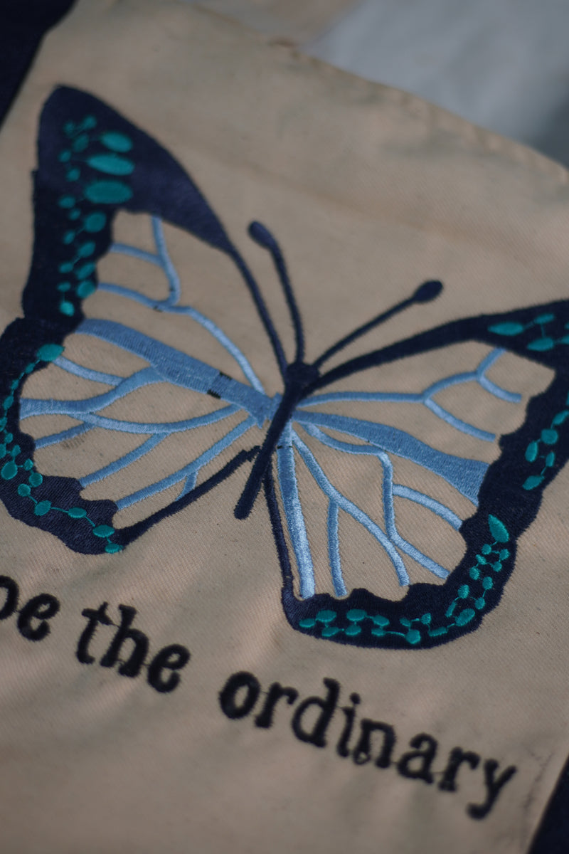 Escape the Ordinary , Butterfly Embroidered beige color jeans tote bag