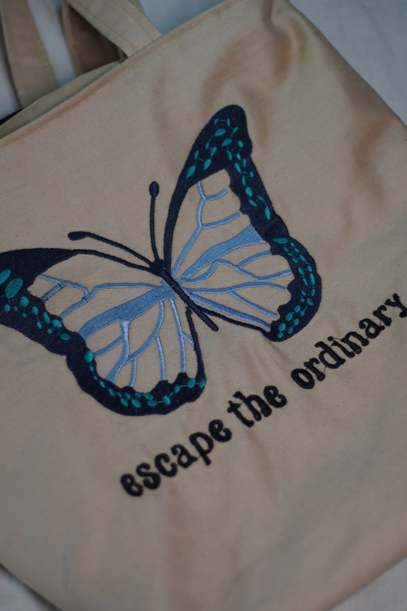 Escape the Ordinary , Butterfly Embroidered beige color jeans tote bag