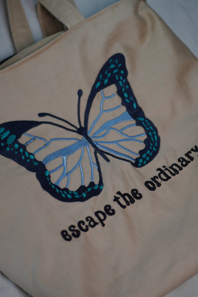 Escape the Ordinary , Butterfly Embroidered beige color jeans tote bag